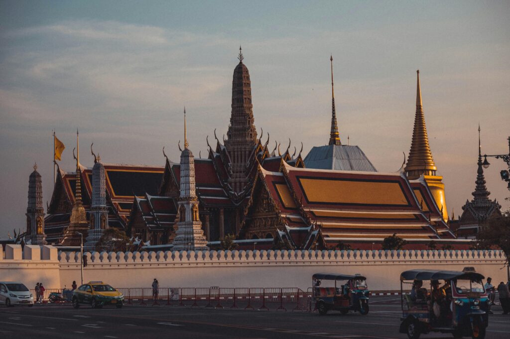 Thailand Trip Guide 2026: Budget, Places, Itinerary & Activities Captivating photo of Wat Phra Kaew temple in Bangkok, showcasing its intricate architecture at dusk.